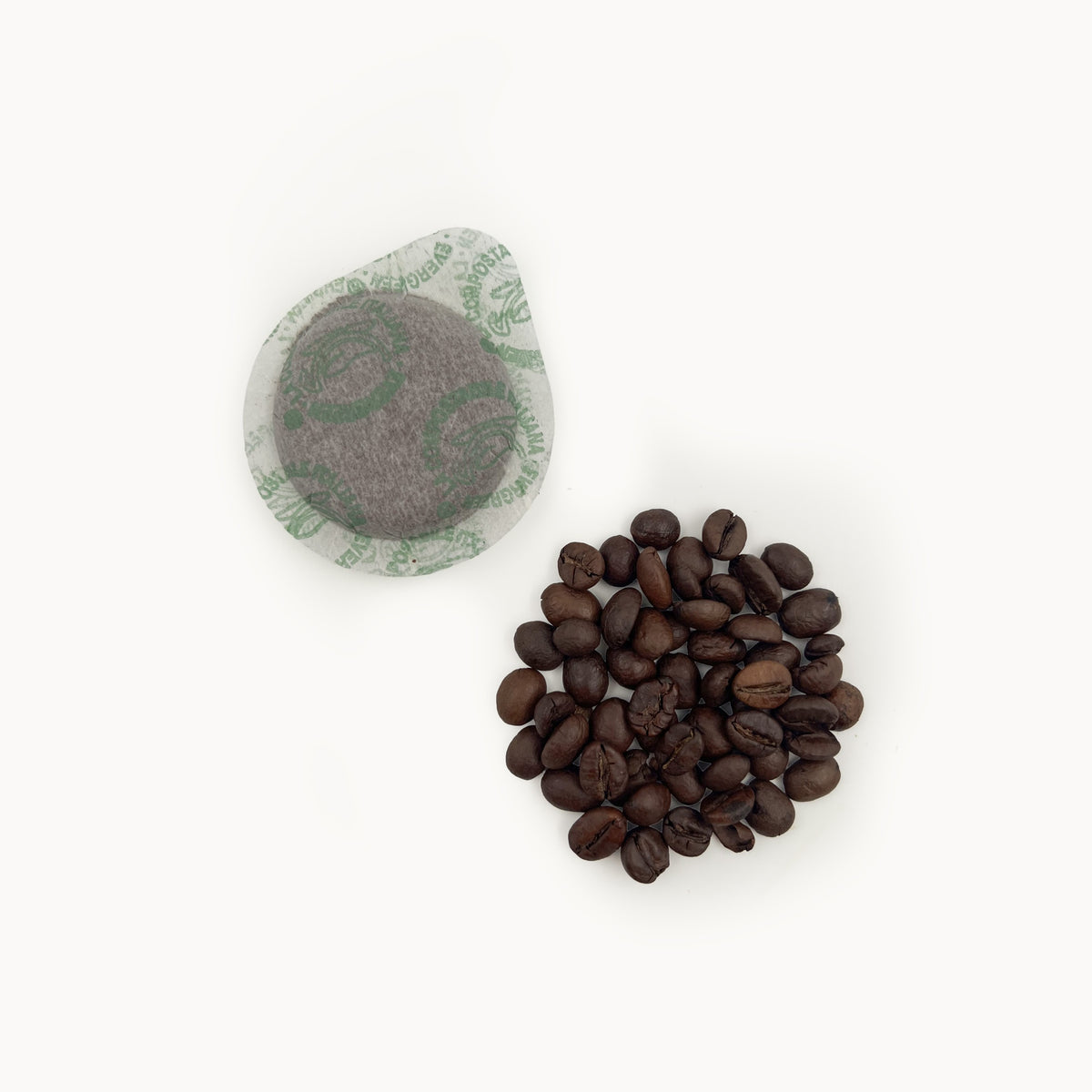 Tiomoka ESE pod next to the roasted beans of the blend